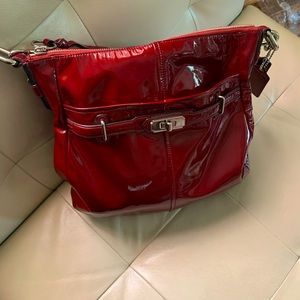 Coach patent leather shoulder bag in burgundy with silver hardware